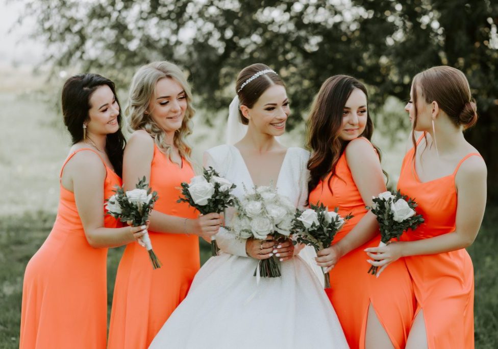 wedding-photography-happy-bride-bridesmaids-pink-dresses-embracing-with-smile-wedding-d